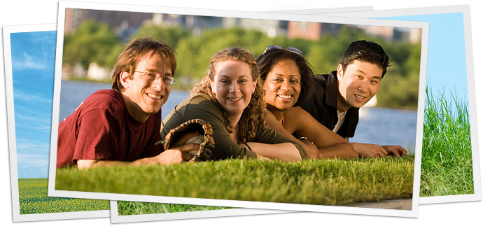 photo of four adults laying in grass